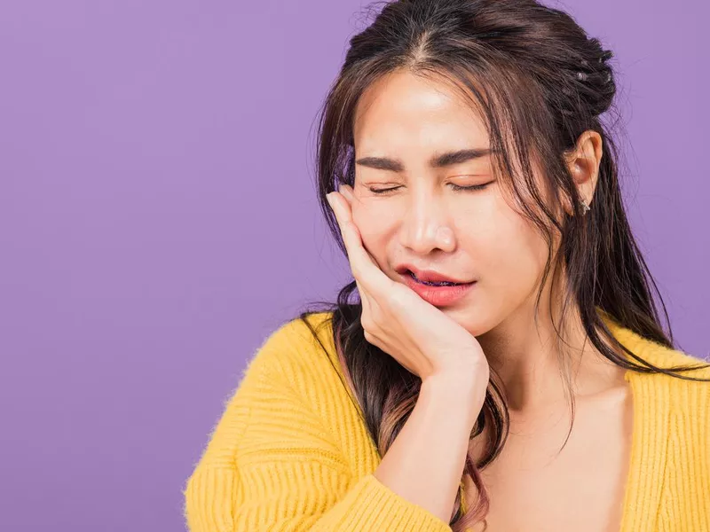 Woman suffering from toothache