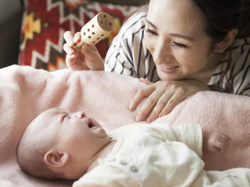 Baby being entertained with a toy