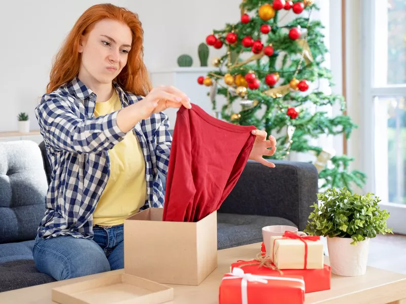 Sad woman disappointed by bad product purchase