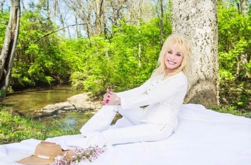 Dolly Parton by a stream