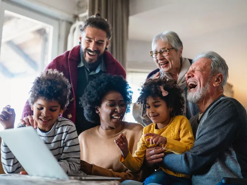 Happy multigenerational family on computer together