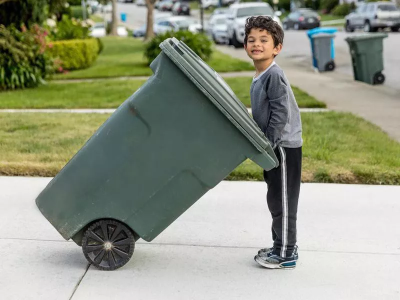 Boy Taking out Trash