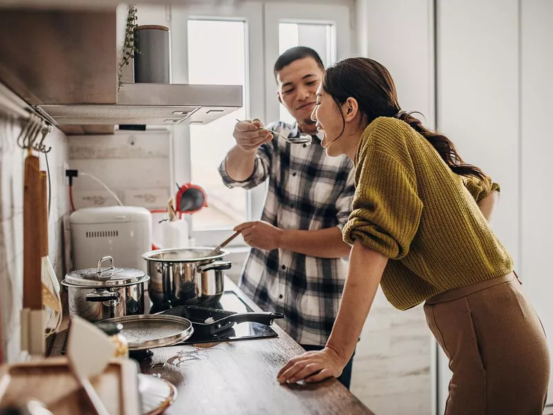 Man cooking for wife