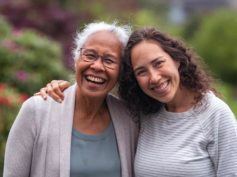 Mother and daughter smiling