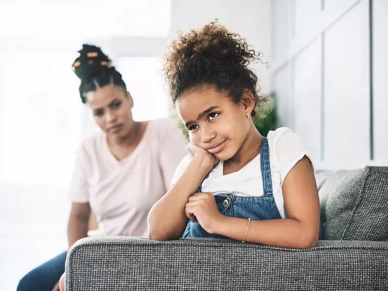 Shot of a young mother reprimanding a child at home