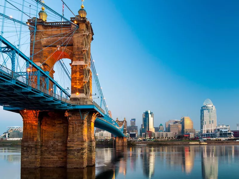 Cincinnati skyline and Roebling Suspension Bridge at dawn