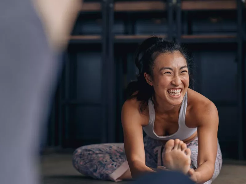 Woman warming up before the yoga session