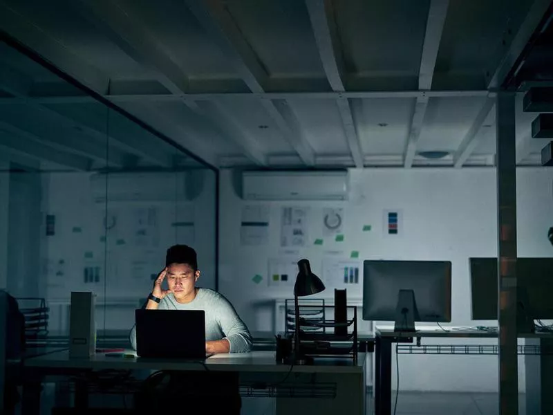 stressed man working in office