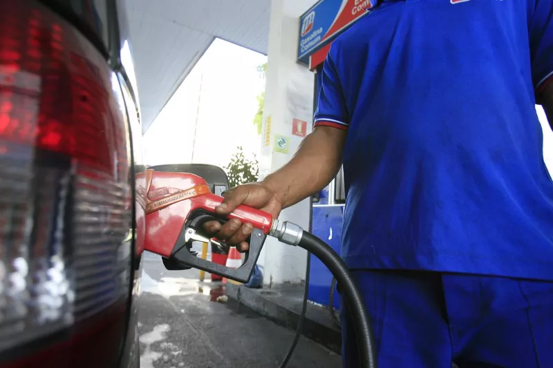 Pumping gas into a car gas station