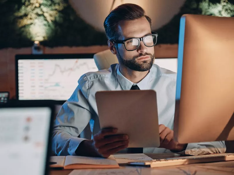 Confident young man working on computer