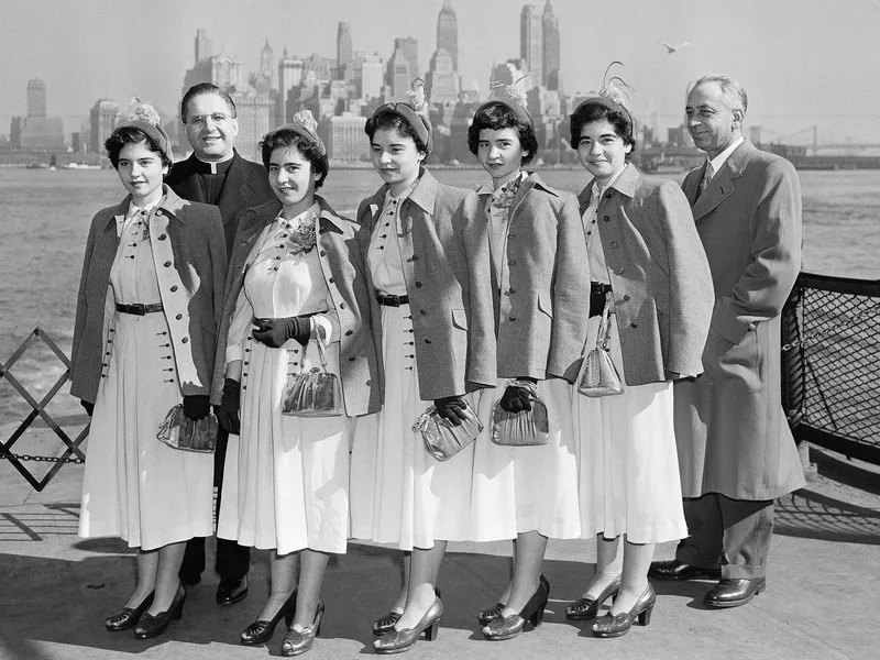 The Dionne Quintuplets with their Father