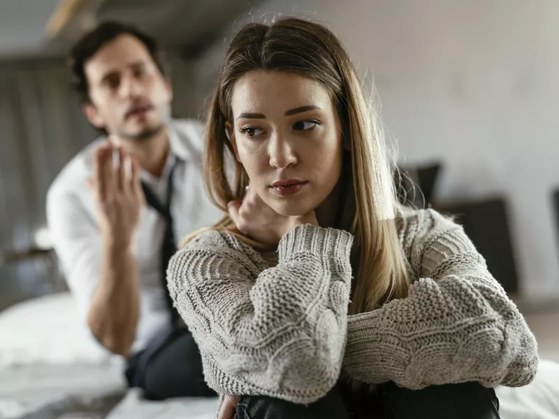 Angry man is yelling at his wife.