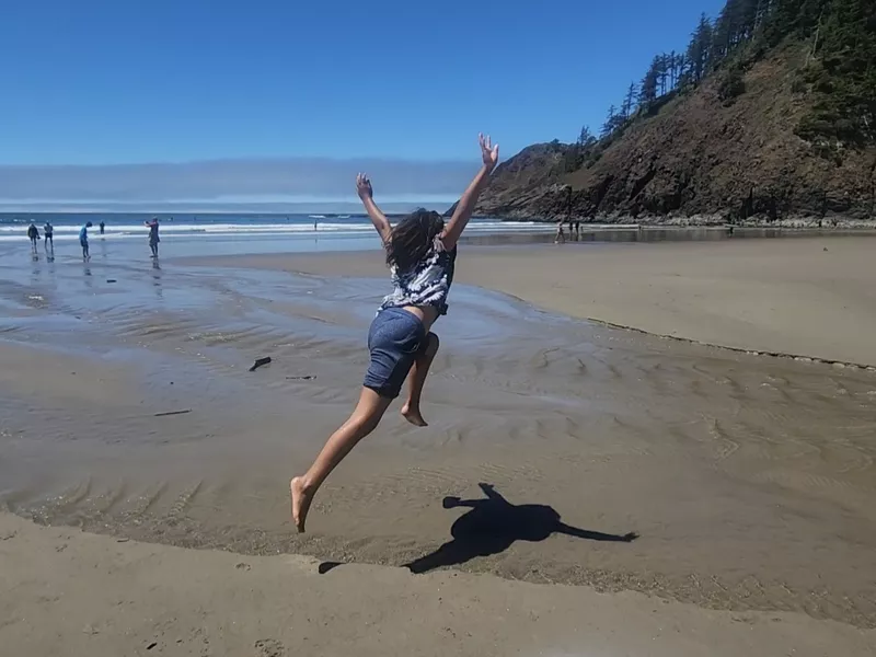 Girl playing on the beach