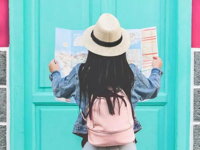 Girl looking at a world map