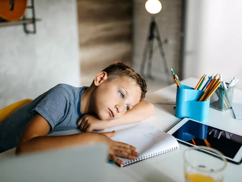 Kid taking a break from online learning