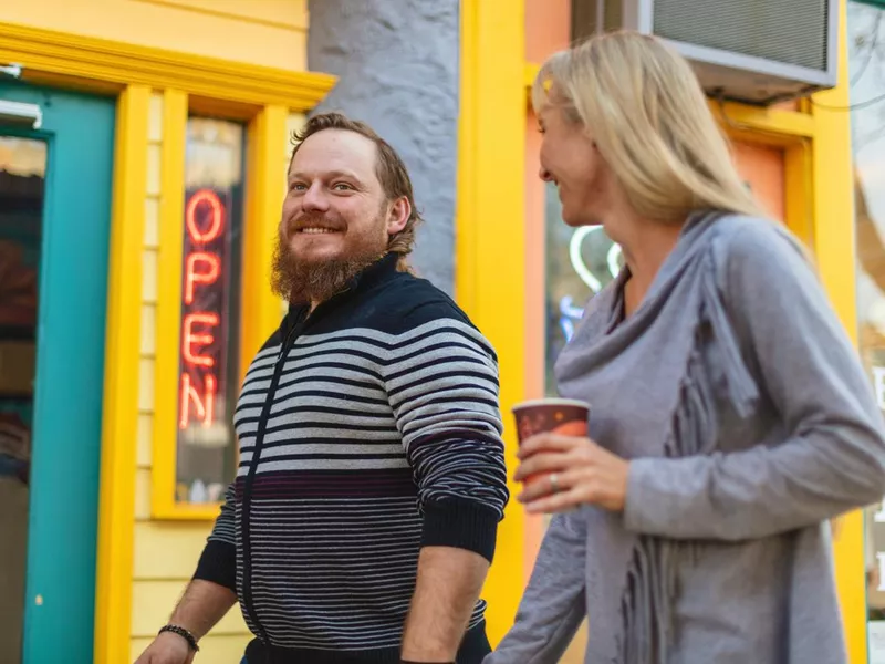 Millennial Couple Outdoors in Small Town America Having Coffee and Pastries Photo Series