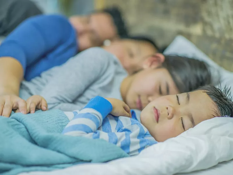 Family of four co-sleeping