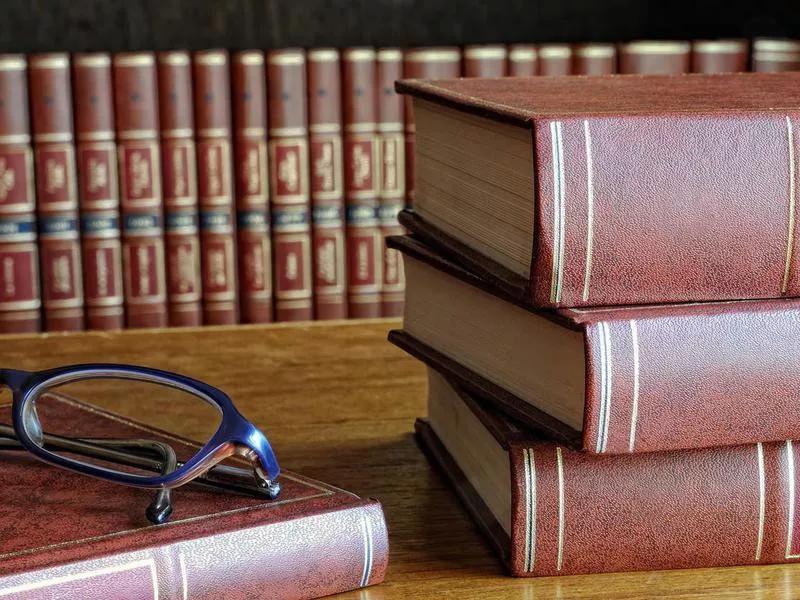 books on the table and glasses