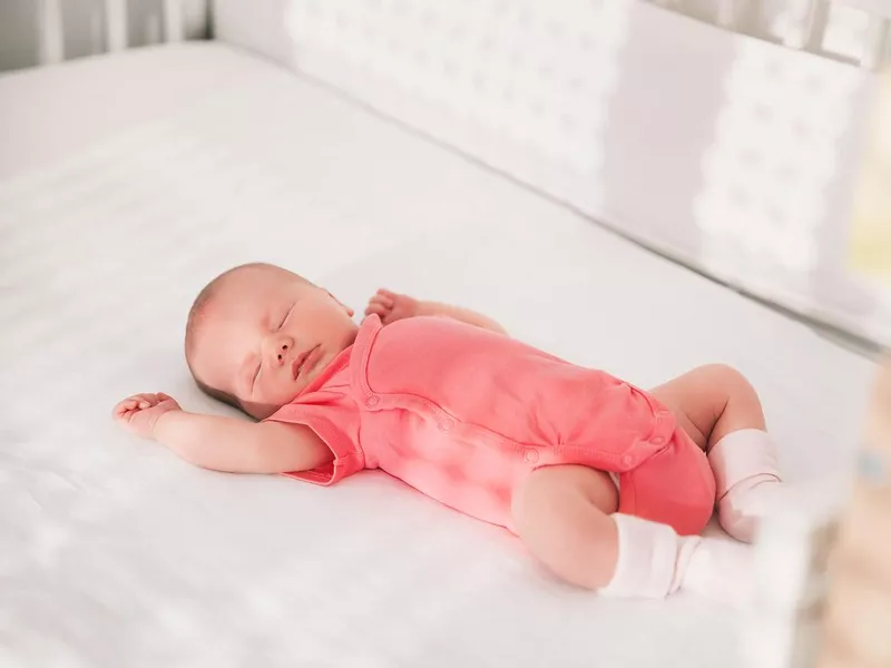 Newborn baby girl sleep first days of life.