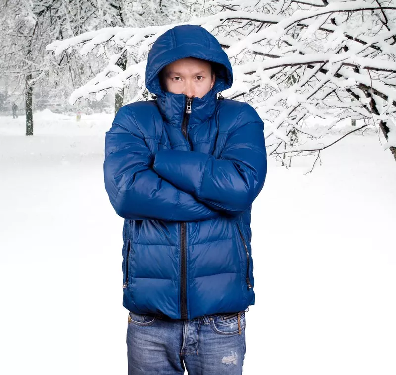 Sad man in blue down padded coat