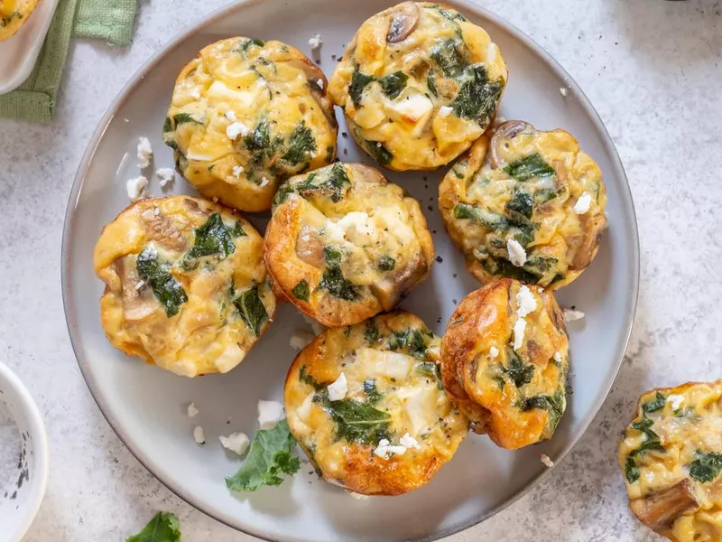 Vegetarian egg muffins with mushroom, kale and feta cheese for Breakfast