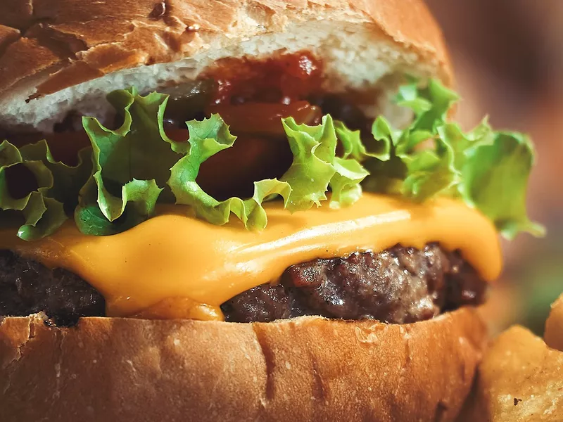 American cheese on top of a burger