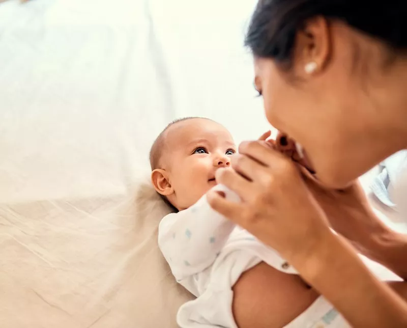 Mother and baby smiling at each other