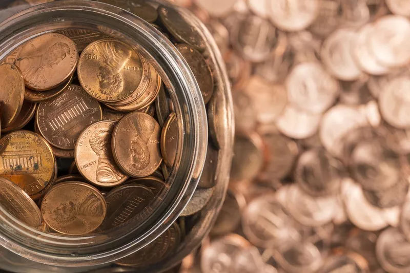 Overflowing penny jar