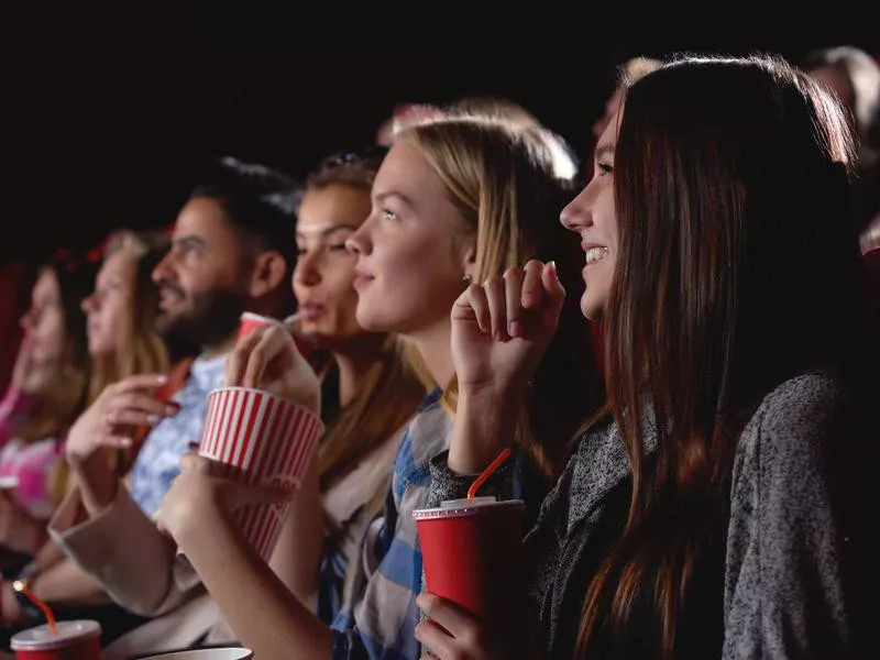 Group of people enjoying movie at the cinema