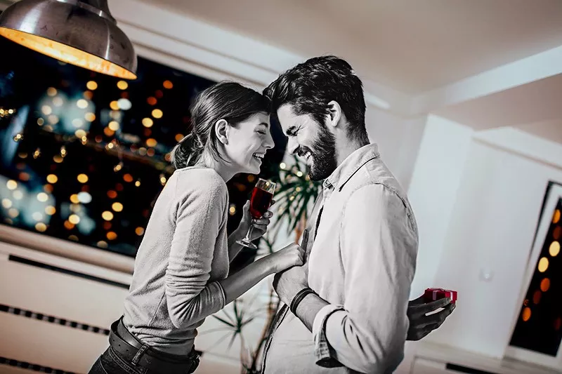 Man holding gift for woman