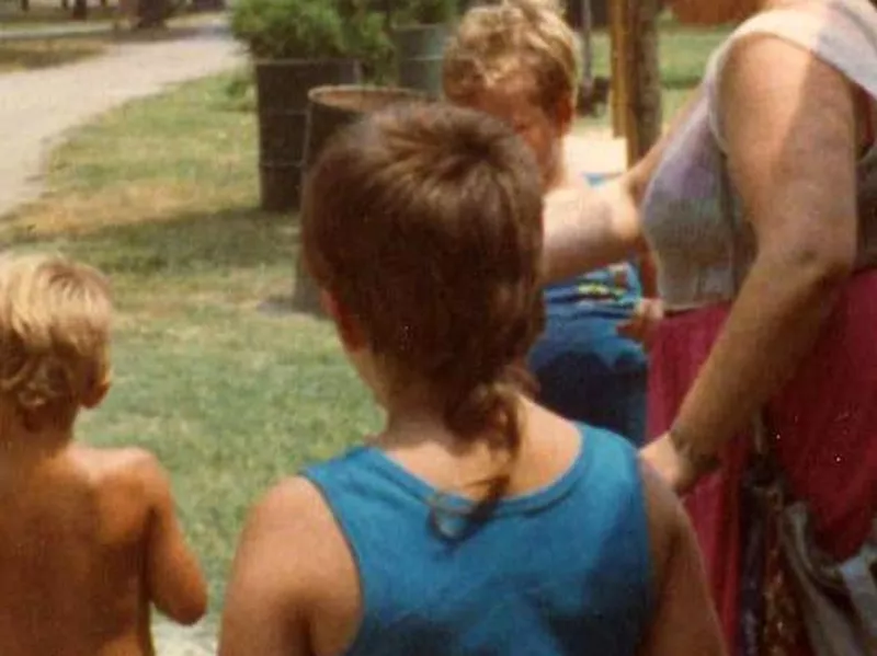 Child with rat tail hair cut