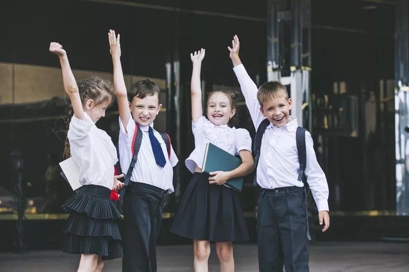 Happy school children in a uniform