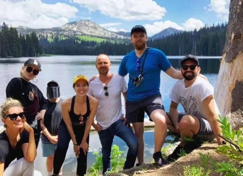 Aaron Paul poses at scenic lake in Idaho