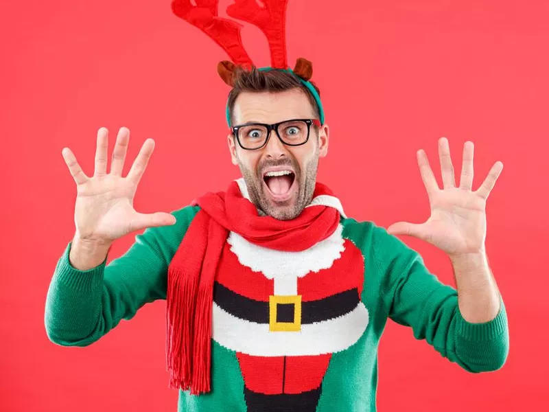 Man wearing red and green Christmas shirt