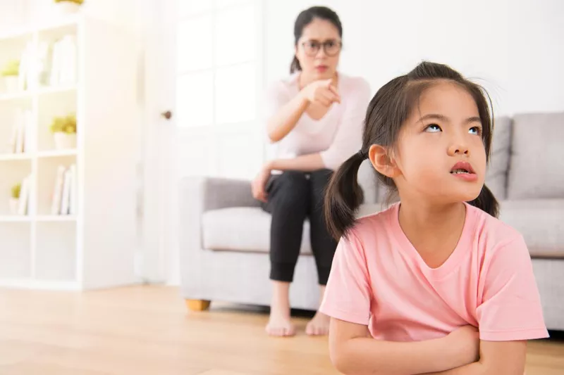 Girl rolling her eyes at mom