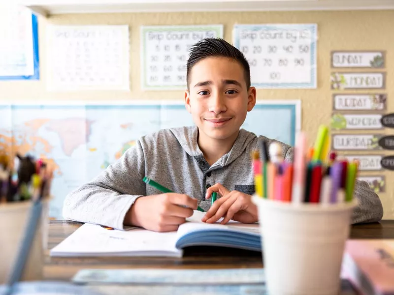 Boy doing schoolwork at home