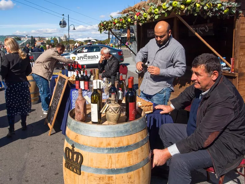 Owners of private wine companies present their wine for tasting at festival