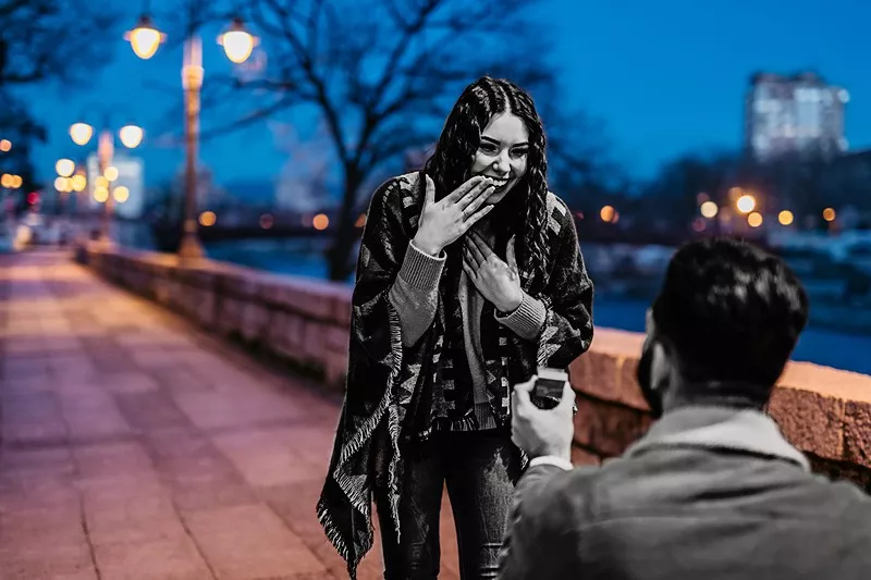 Young man proposing to his girlfriend