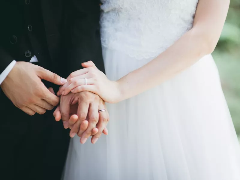 Couple holding hands