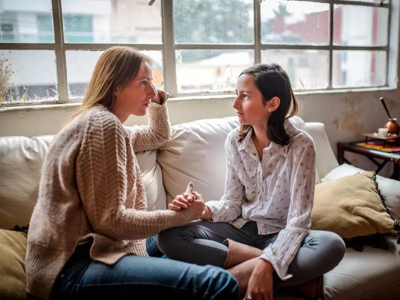 Mother and daughter having a talk.