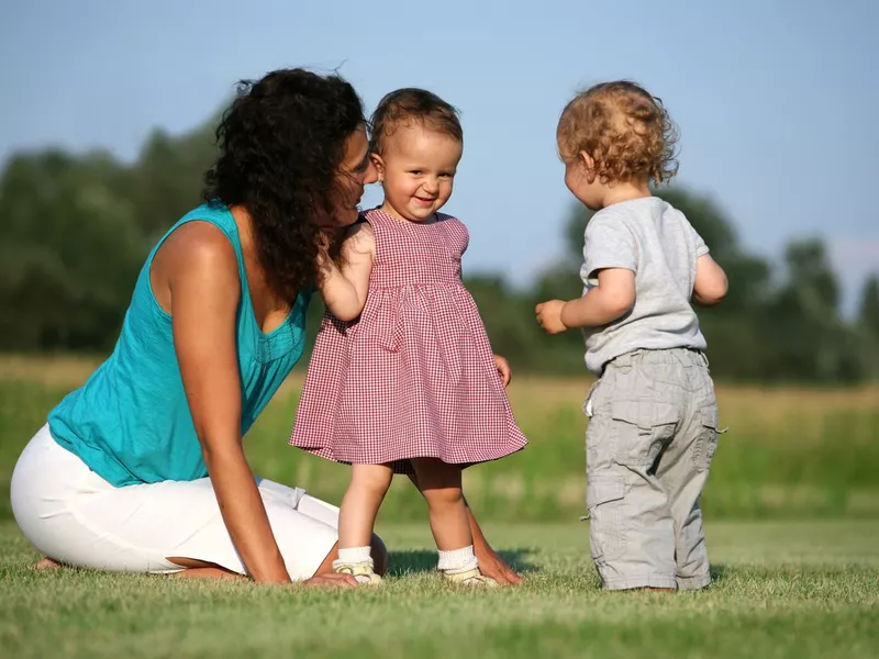 Shy little girl making friends