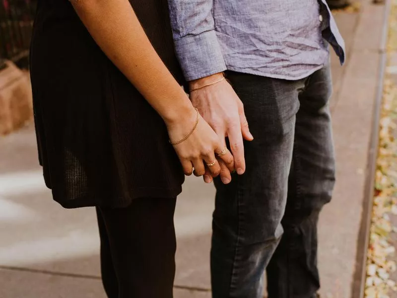 Couple holding hands