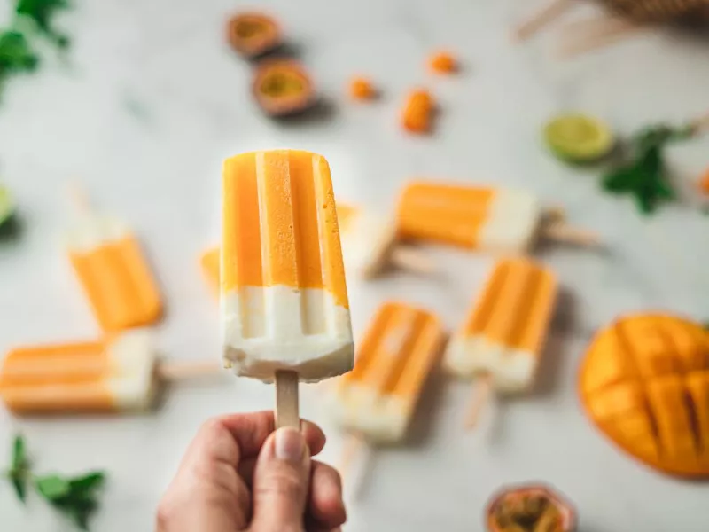 Mango yogurt ice cream in hand