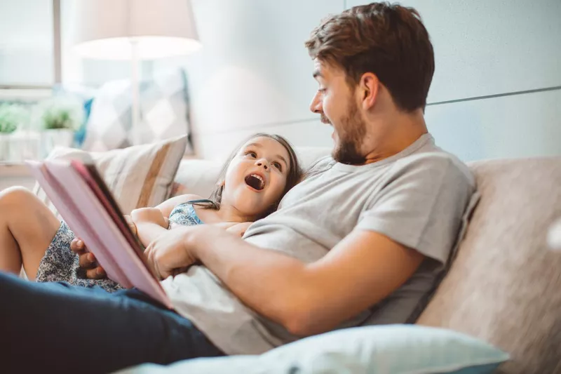 Father and daughter enjoying at home.