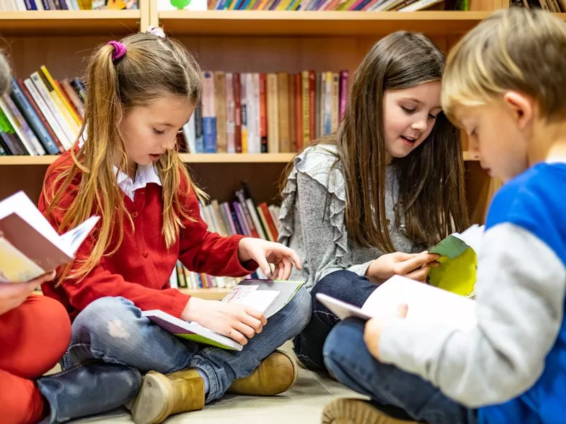 Schoolchildren reading books