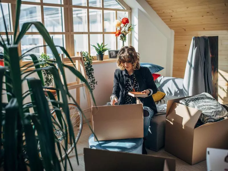 Woman moving in into new apartment