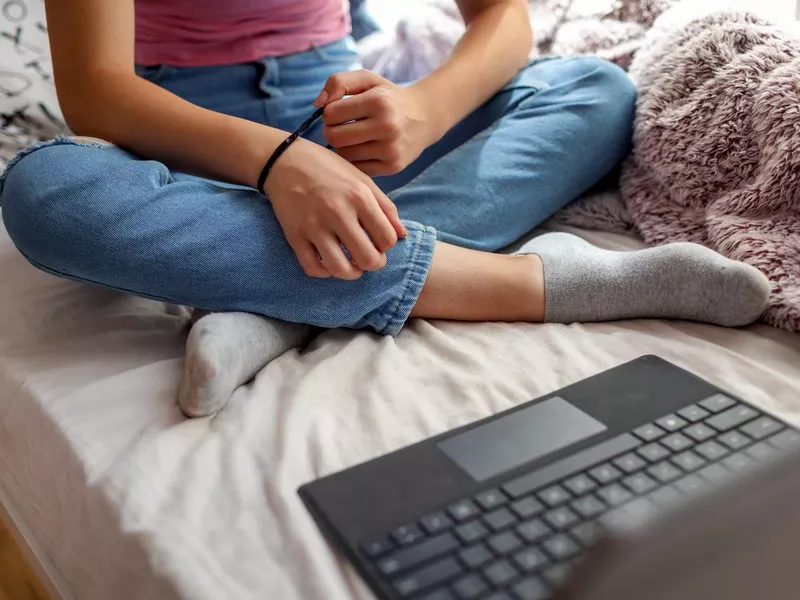 Teenager using a rubber band to combat anxiety