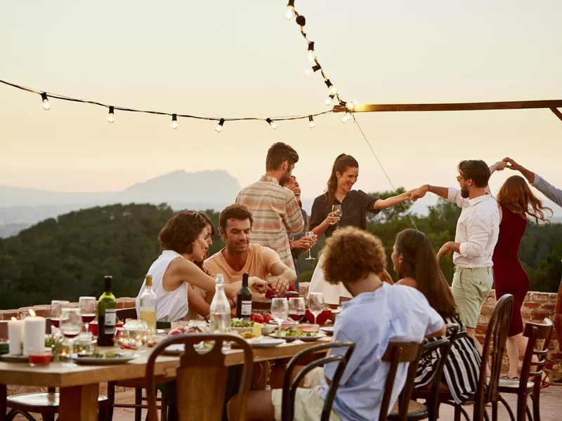 Friends enjoying at patio during social gathering