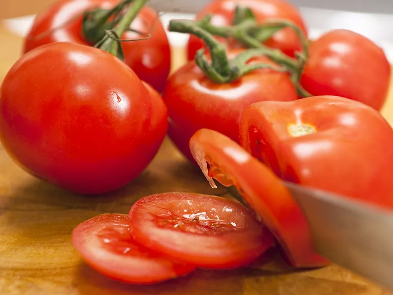 Tomato on top of burgers