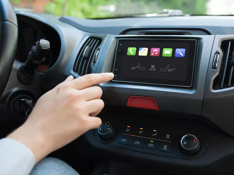 Man hand touching to screen multimedia system with Auto Play